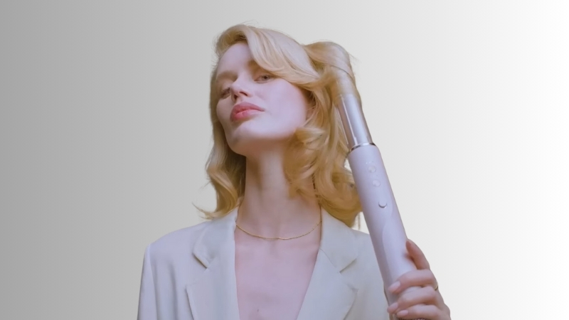 Woman uses an airflow styling tool as a Dyson Airwrap alternative to create loose waves