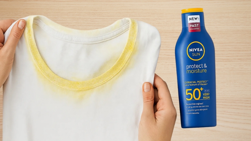 Yellow sunscreen stains visible on a white shirt next to a sunscreen bottle