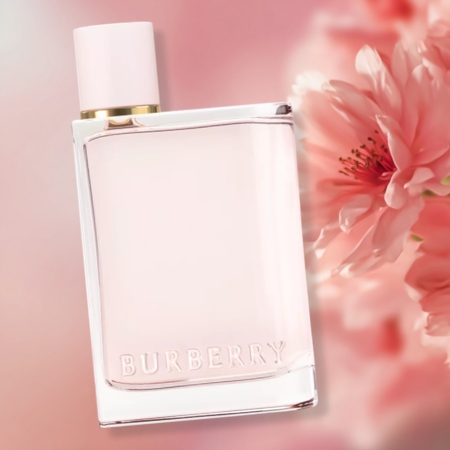 Burberry Her Eau de Parfum bottle with pink flowers on a soft pink background