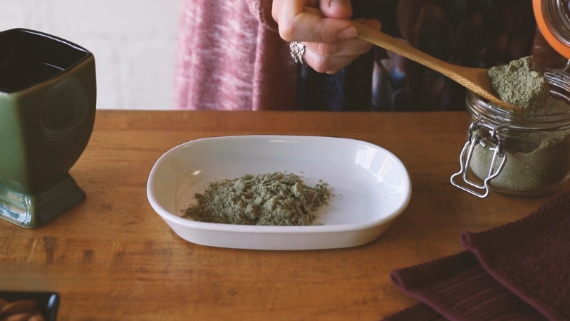 Green tea powder prepared on a plate for use in a natural skincare routine